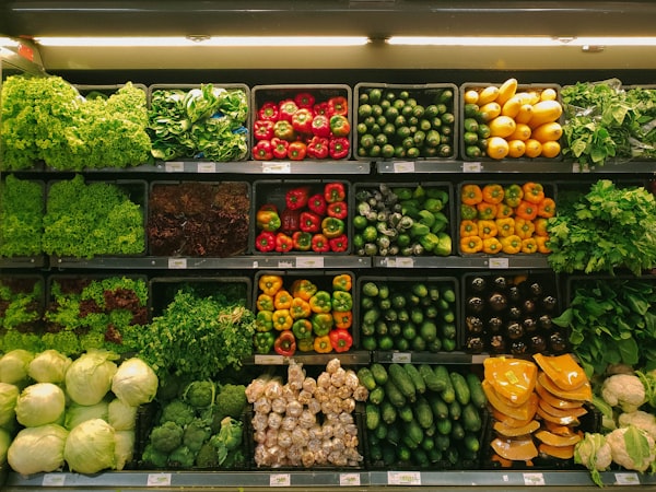 Location Supermarket shelves stocked with fresh vegetables and salad